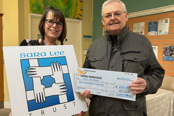 Bill Goddard hands a Cheque to Cathy Cobley